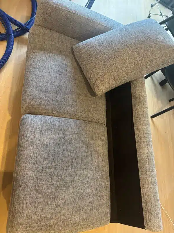After grey fabric couch with a stained seat cushion cleaning by Everfresh Cleaning in Melbourne